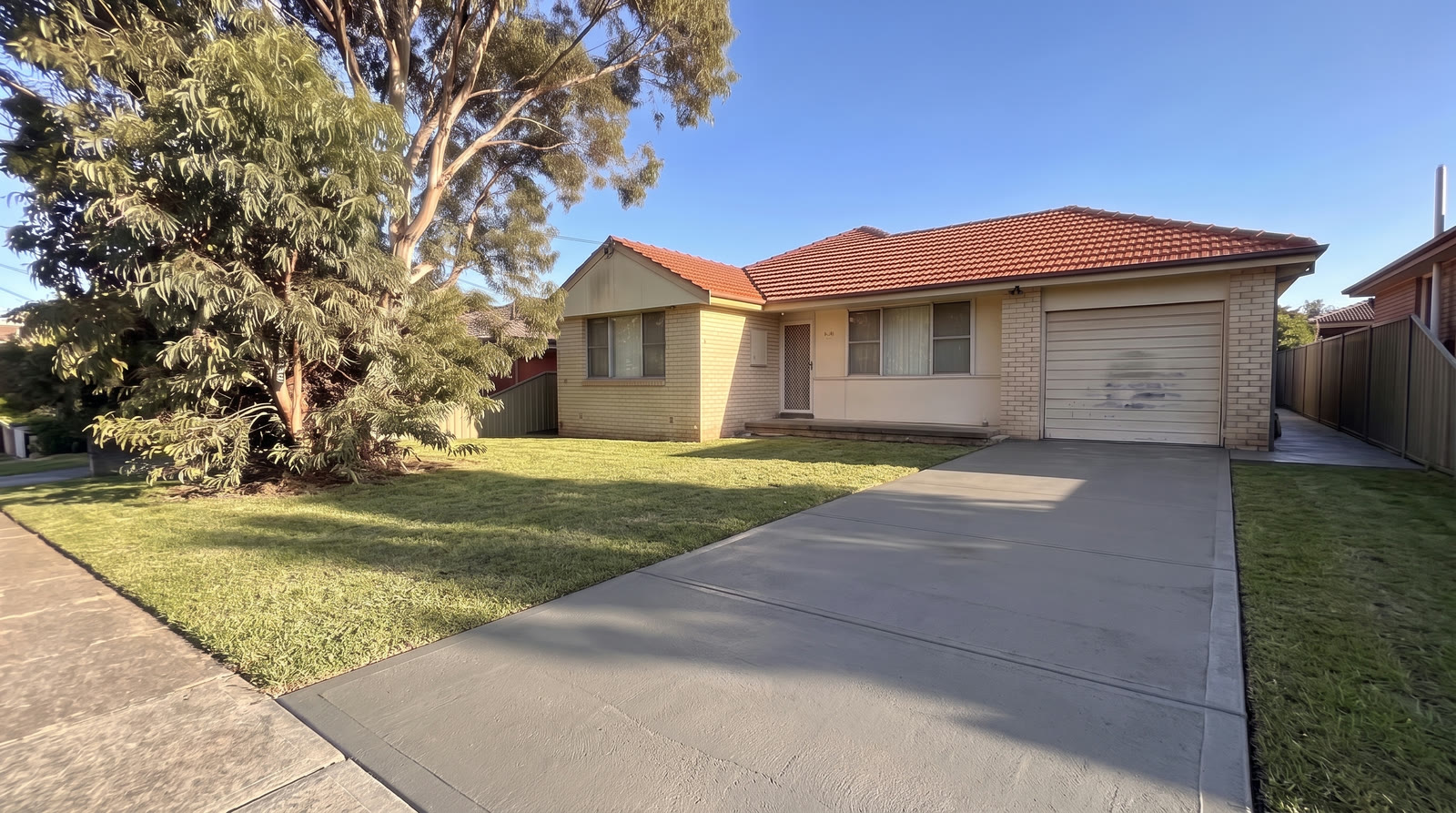 A smooth, resurfaced concrete driveway